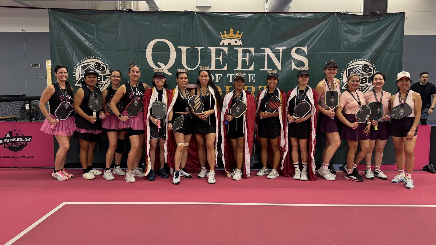 Queens of the Court players posing with medals and paddles