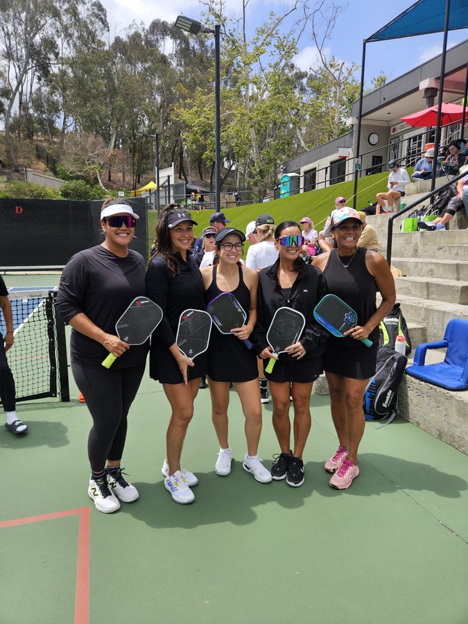 Queens of the Court team in black uniforms